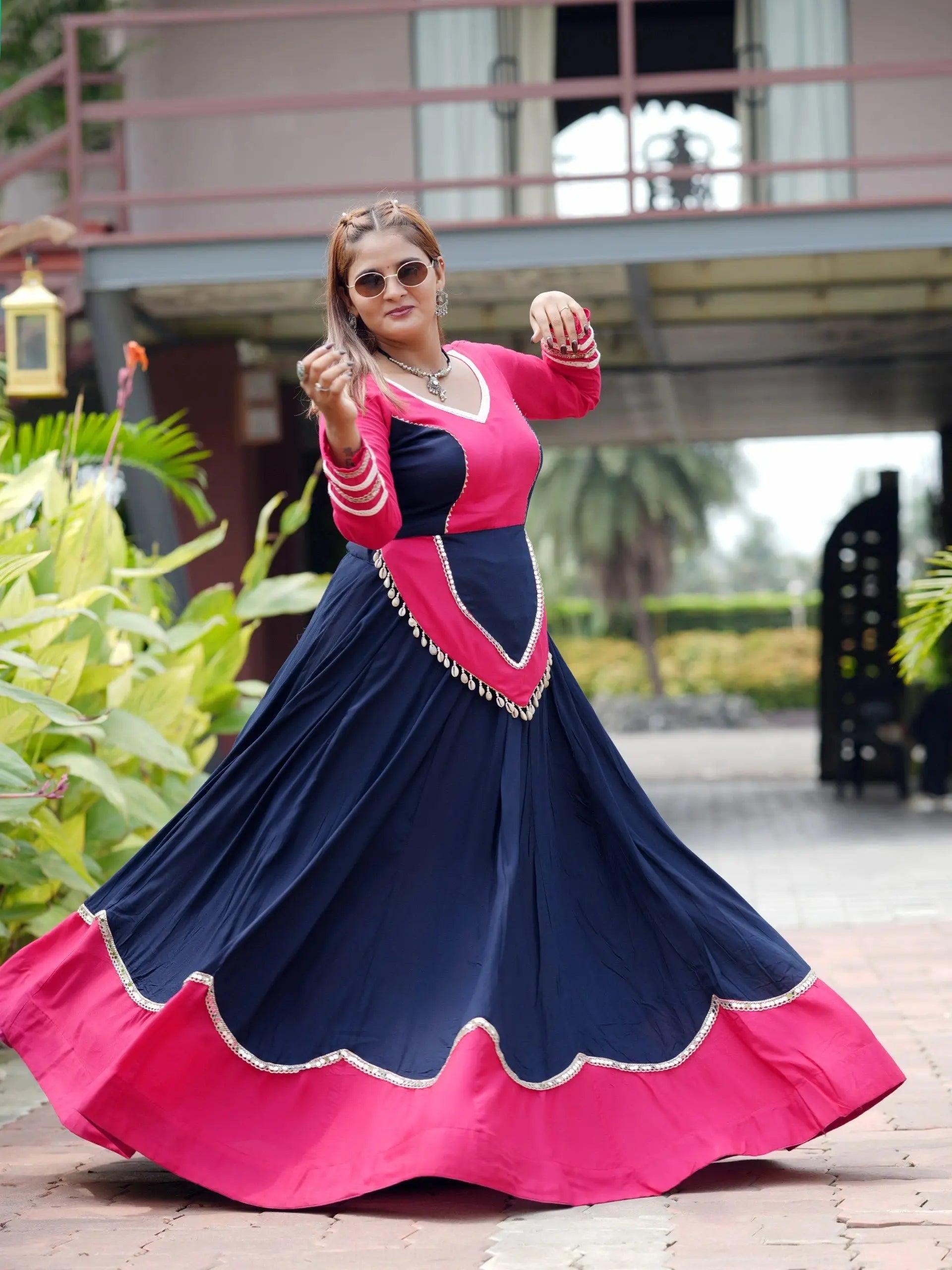 Navy Blue 6-meter flair lehenga twirling with pink underlayer and scalloped sequins hem border