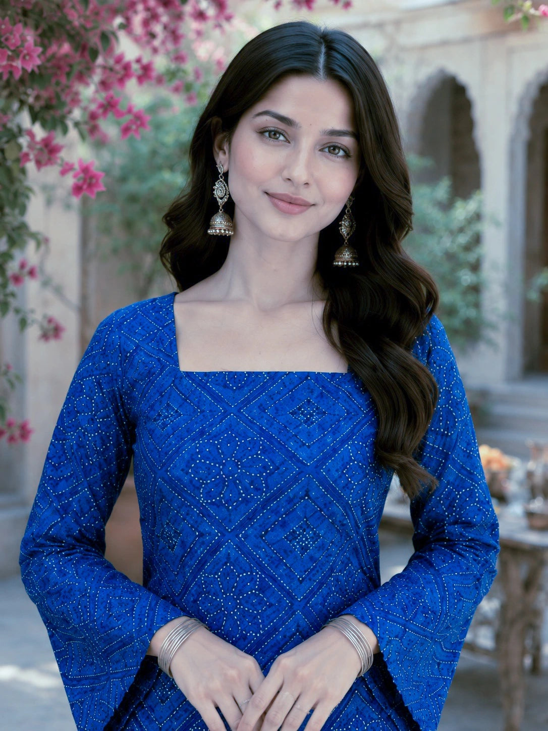 Woman in a blue dress with floral and architectural background