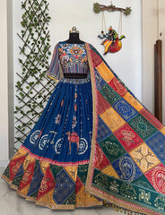 Colorful embroidered traditional outfit on a mannequin with a decorative background.