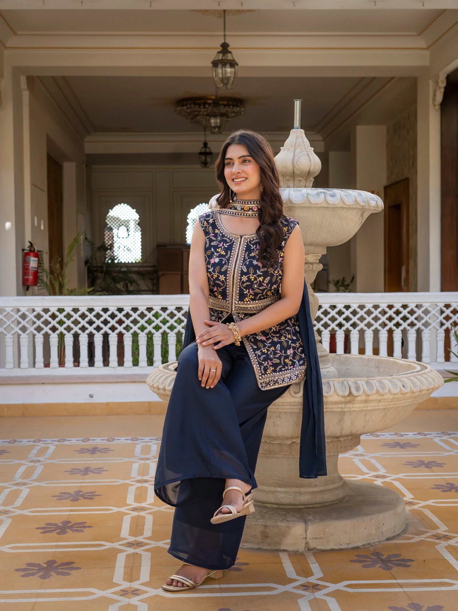 Navy blue georgette suit showcasing heavy embroidery craftsmanship.