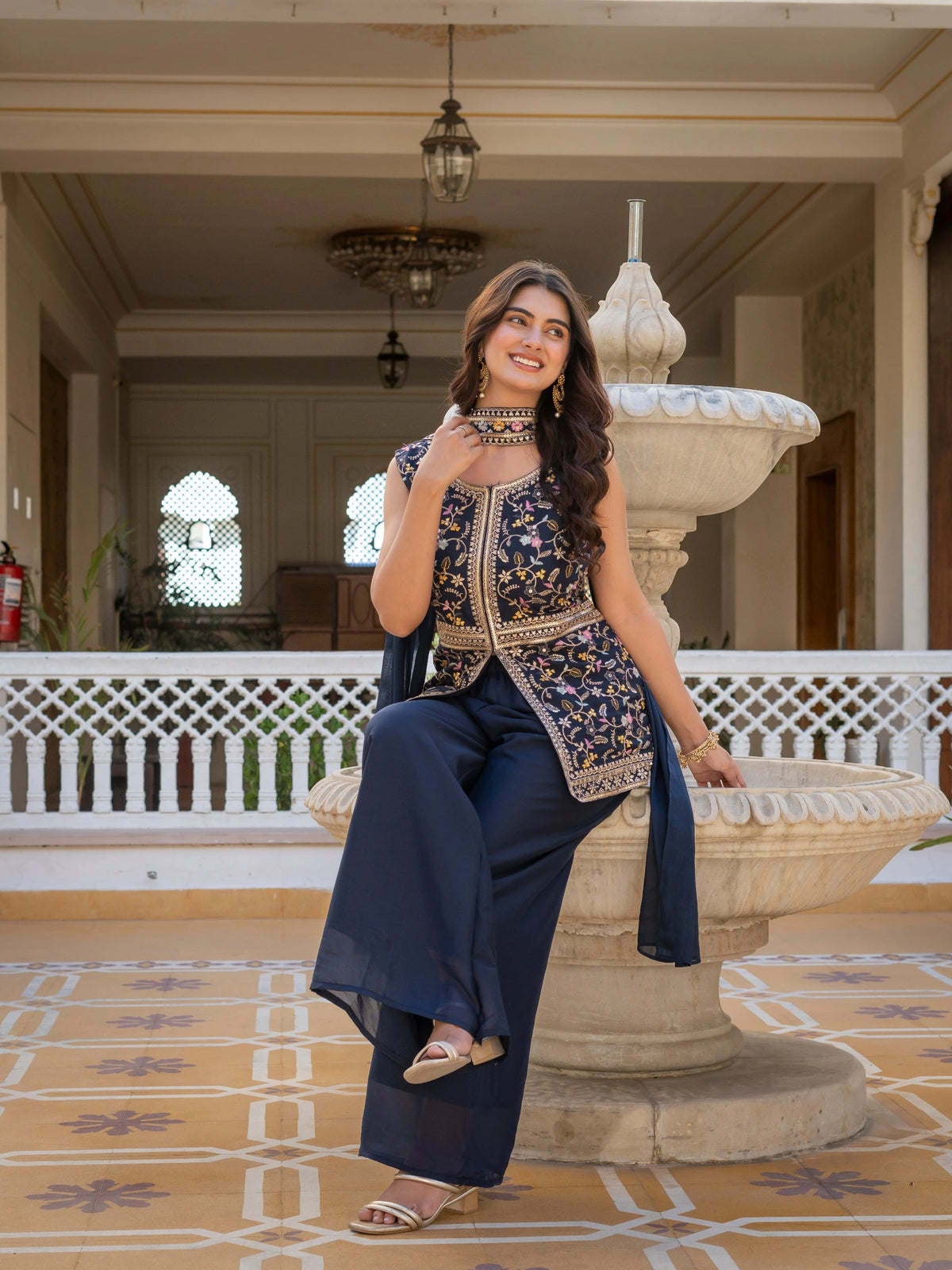 Close-up of neckline embroidery on navy blue georgette suit.