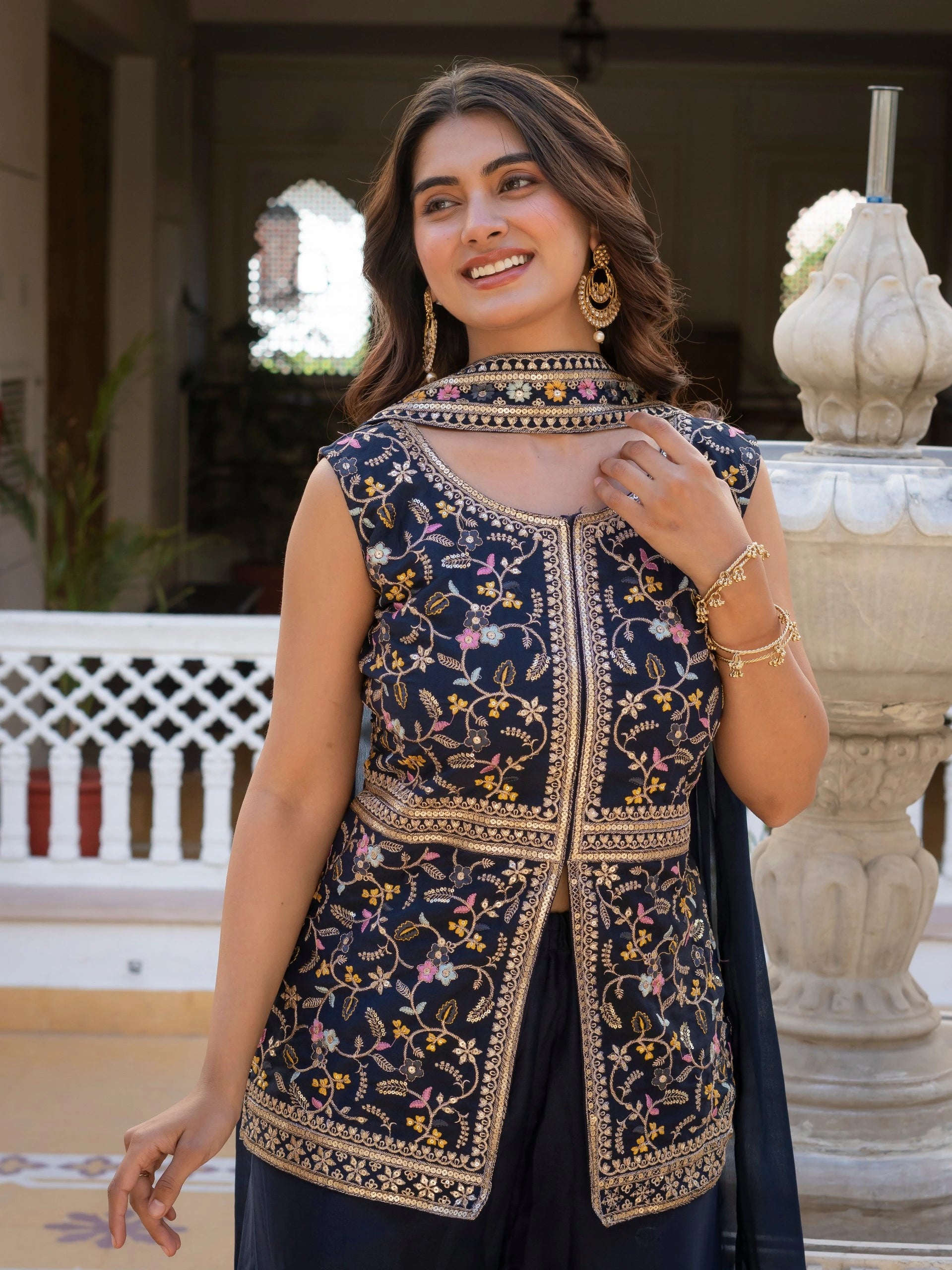 Traditional navy blue georgette suit with rich embroidery work.