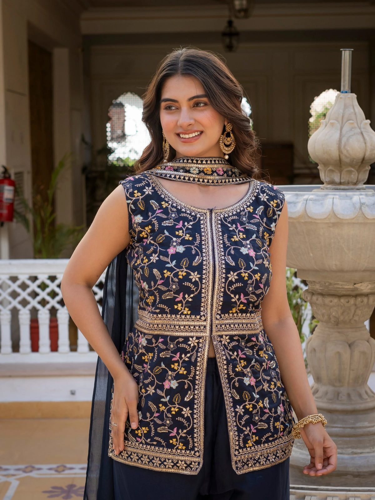 Heavy embroidered navy blue georgette suit styled for festive wear.