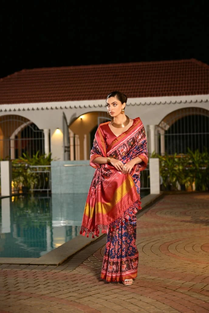Traditional Indian silk saree with geometric Ikkat design showcased online