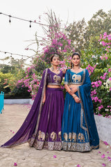 Navy blue embroidered lehenga displayed with matching blouse and dupatta.