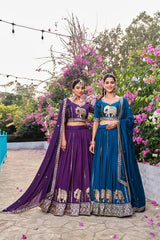 Detailed sequins and moti embroidery patterns on navy blue Pure Fendy lehenga fabric.