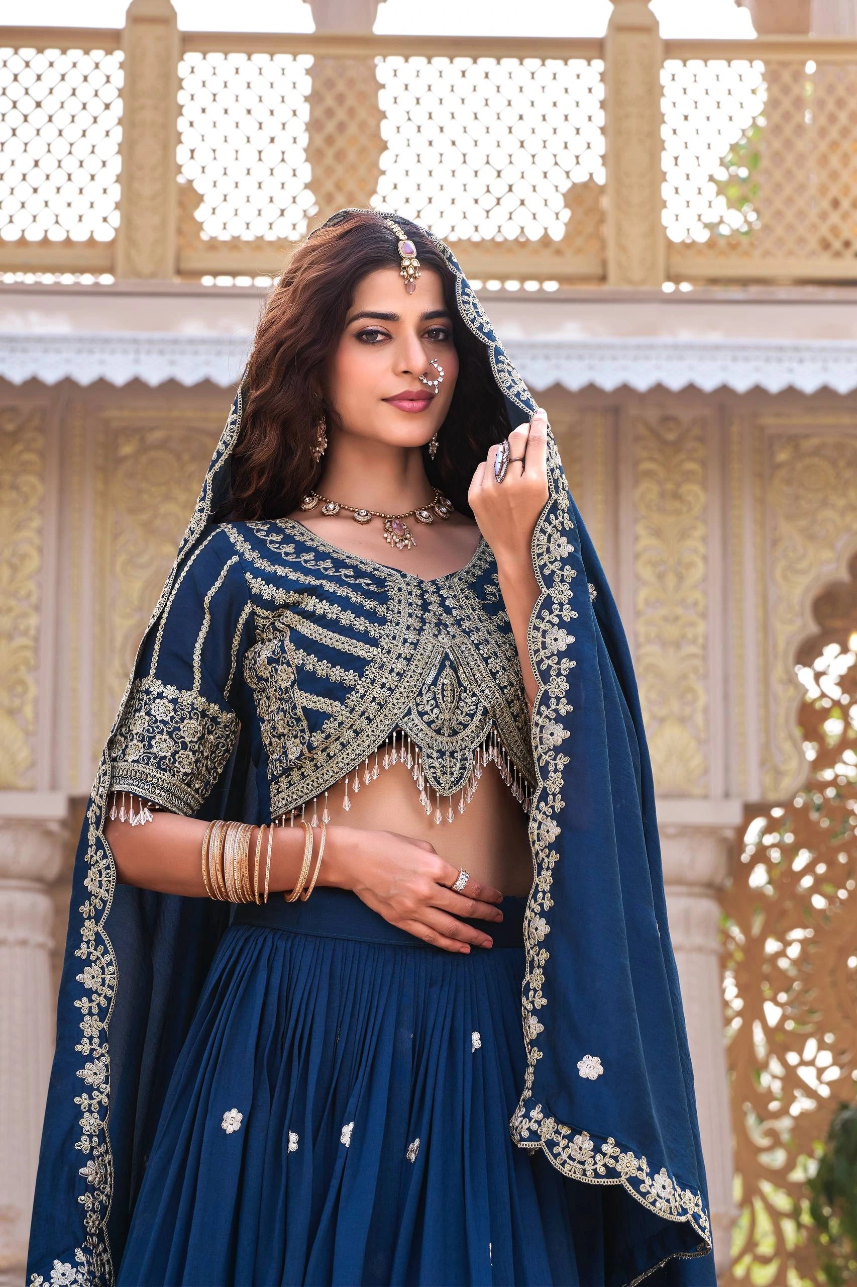 Elegant handcrafted pure Vichitra lehenga in navy blue featuring sequins embellishment