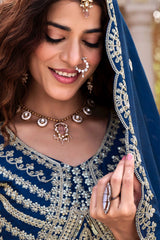 Traditional Indian bridal lehenga in navy blue with shimmering sequins showcased online