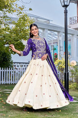 Woman in a traditional outfit with Navy Blue and white colors standing outdoors.