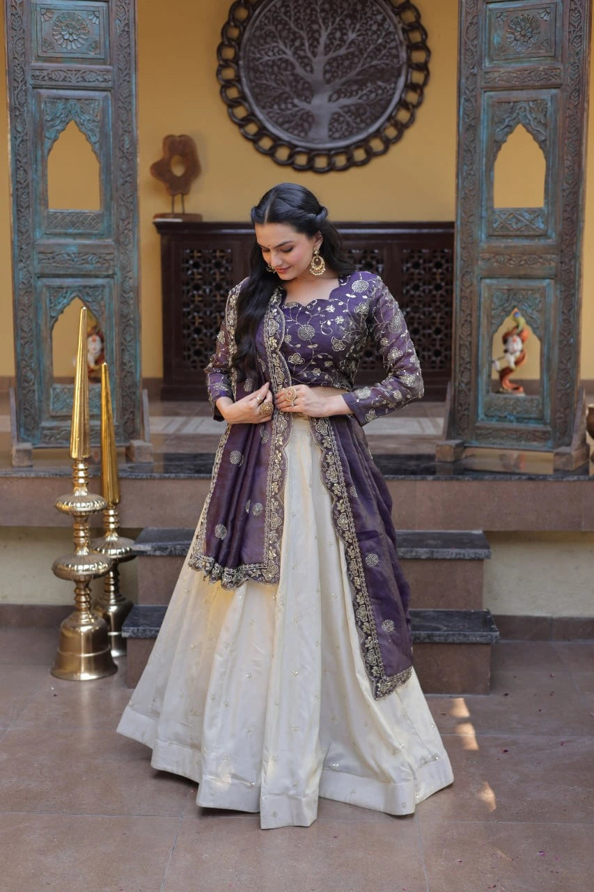 Woman in a traditional outfit standing in a decorated room with ornate walls and decor.