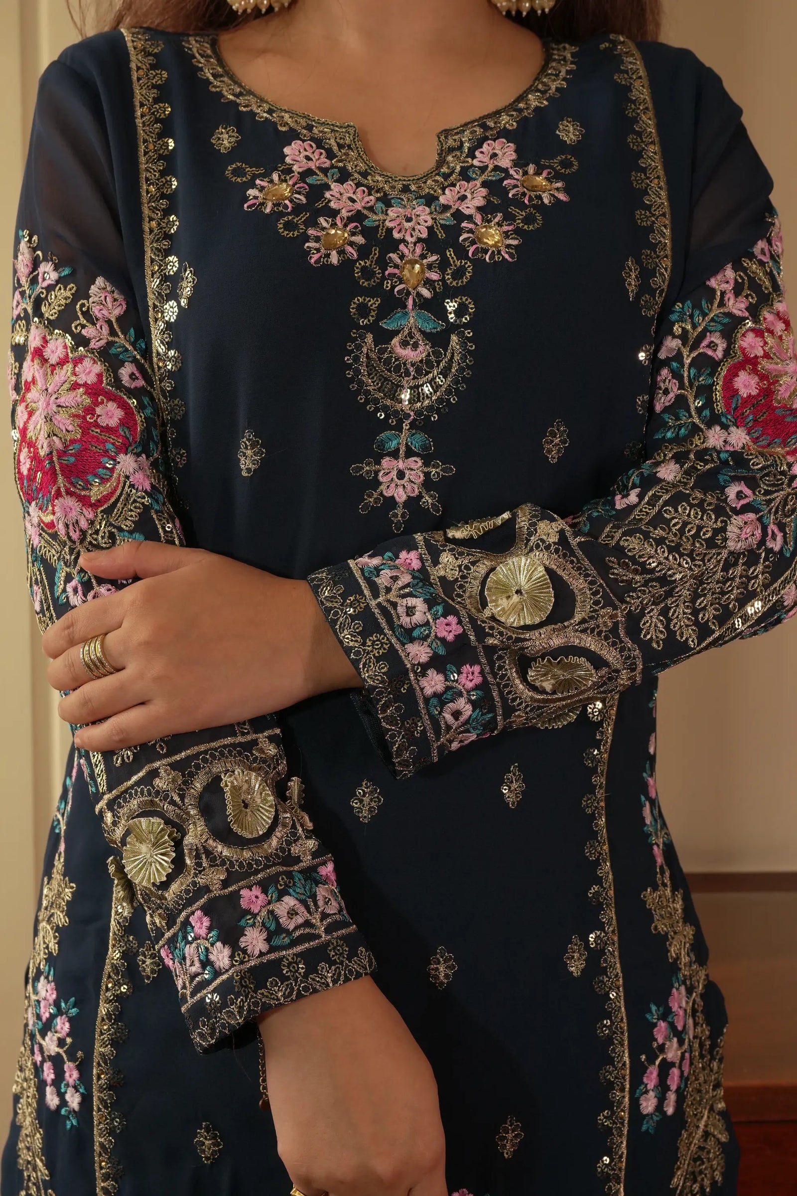 Navy blue embroidered traditional outfit with floral patterns