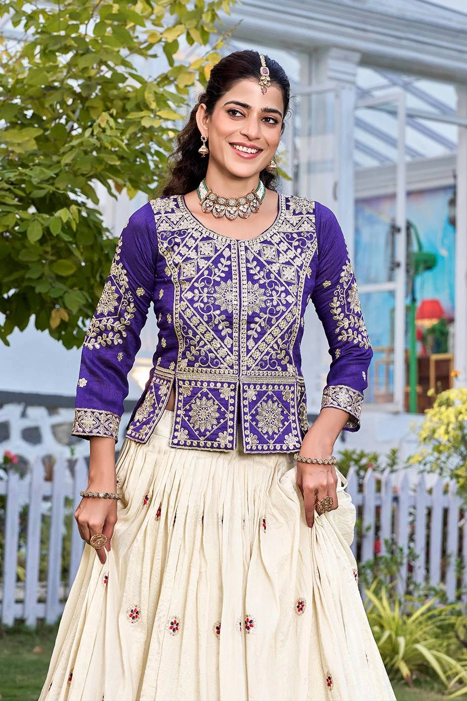 Beautiful festive lehenga set with purple embroidered lehenga  and cream flared skirt, designed with intricate thread and sequins work.