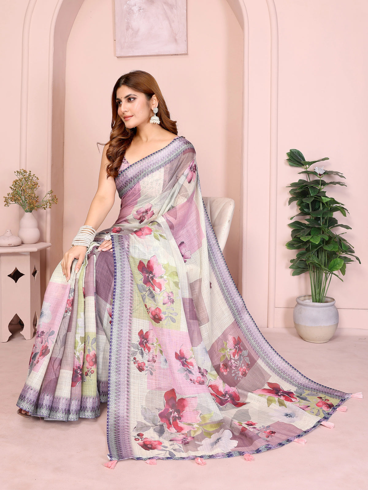 Off White Linen Cotton Saree with Digital Floral Print draped elegantly, seated pose with pallu spread