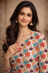 Woman wearing a floral blouse with a neutral background