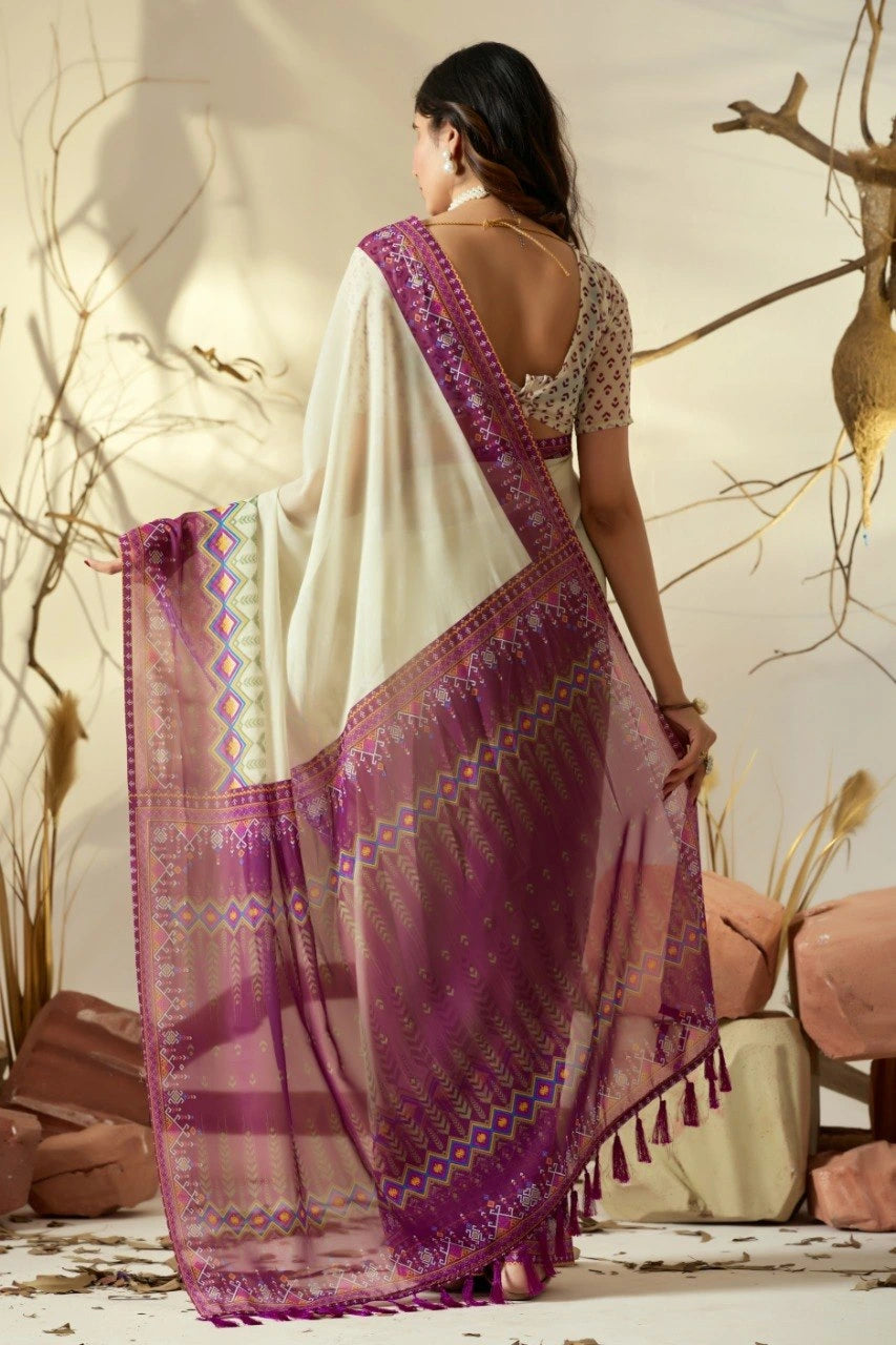 Woman wearing a white and purple saree with a natural setting