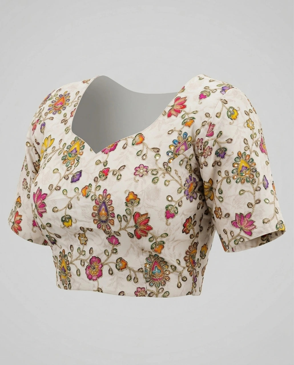 Floral embroidered blouse on a gray background