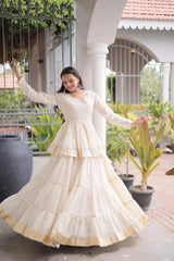 Premium Off White Party Wear Lehenga with Tiered Design, Golden Trim, and Graceful Traditional Look