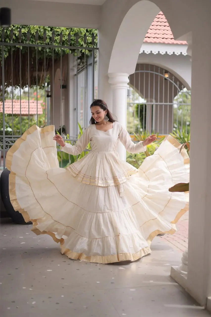 Traditional Off White Lehenga Outfit with Peplum Kurti, Broad Ghera, and Classic Golden Lace Work