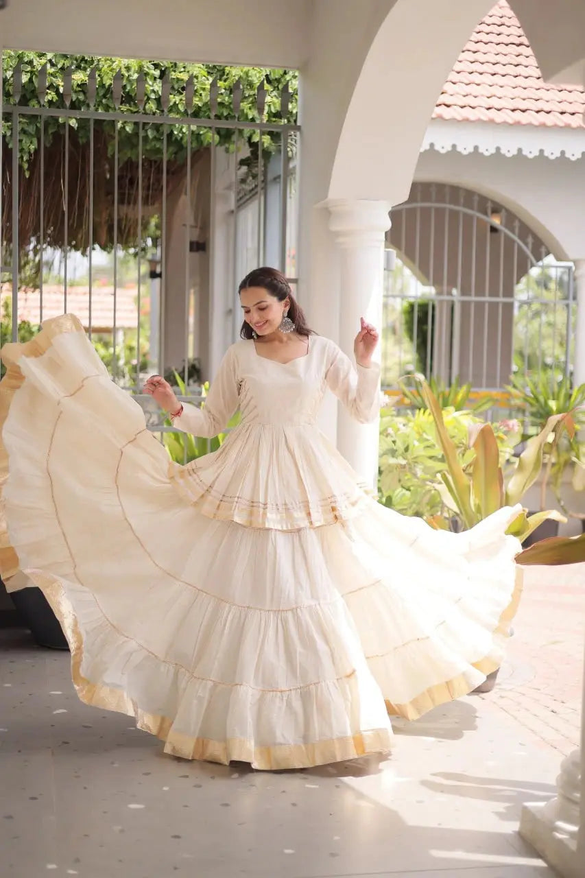 Elegant Ivory White Lehenga Choli Set with Multi Layer Flare and Rich Golden Hemline for Wedding Functions