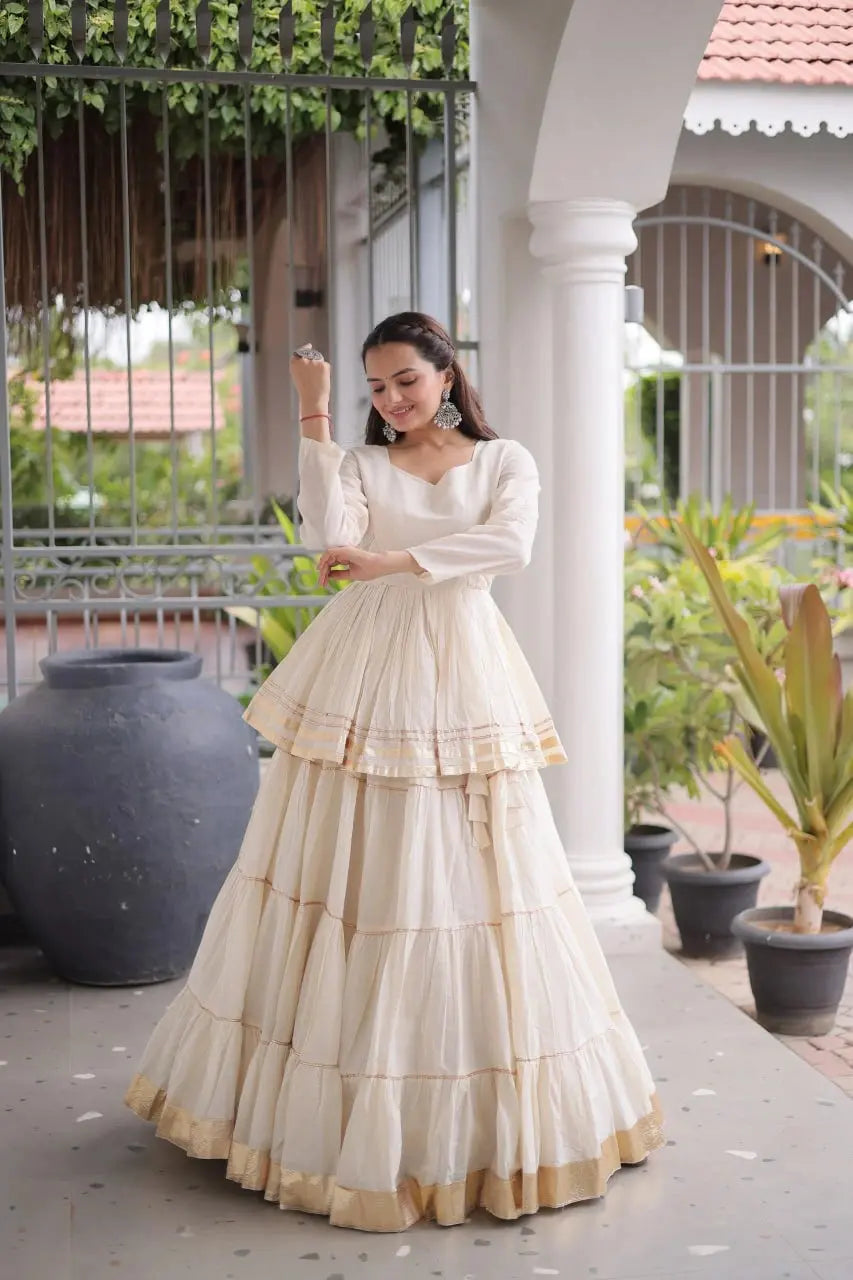 Beautiful Cream White Ethnic Lehenga with Full Sleeves, Tiered Ghera, and Subtle Gota Patti Accents