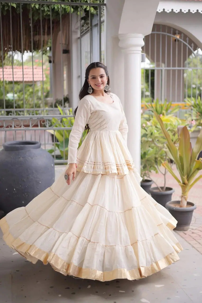 Gorgeous Cream White Lehenga Set with Designer Peplum Top, Flowing Layers, and Festive Golden Border Finish