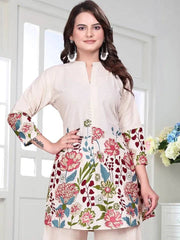 Woman wearing a floral printed top with a white background