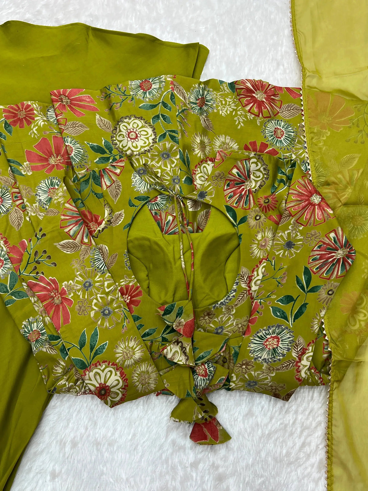 Olive Green Discharge Print Suit flat lay showing kurta, palazzo and dupatta set