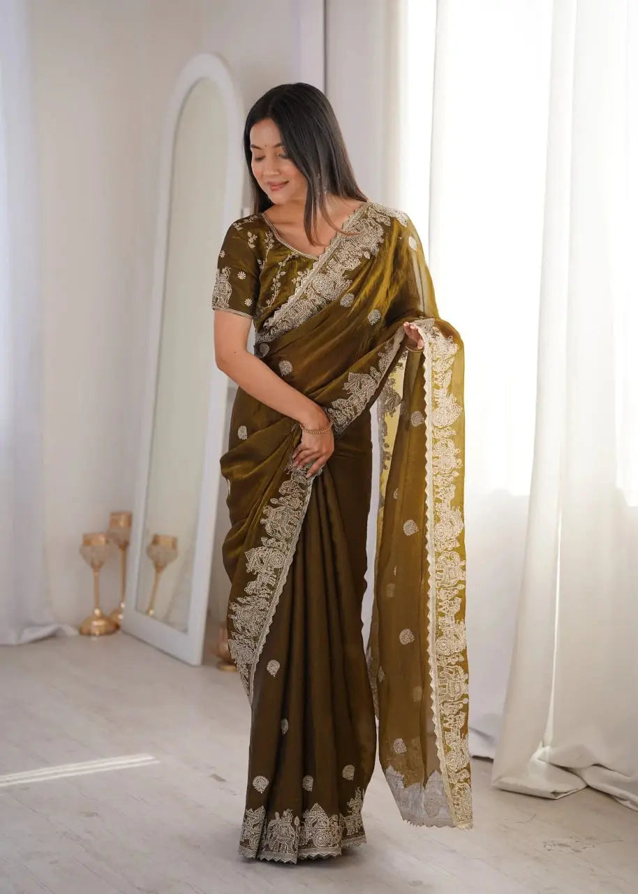 Olive Green Zari Embroidered Saree front view smiling and looking down