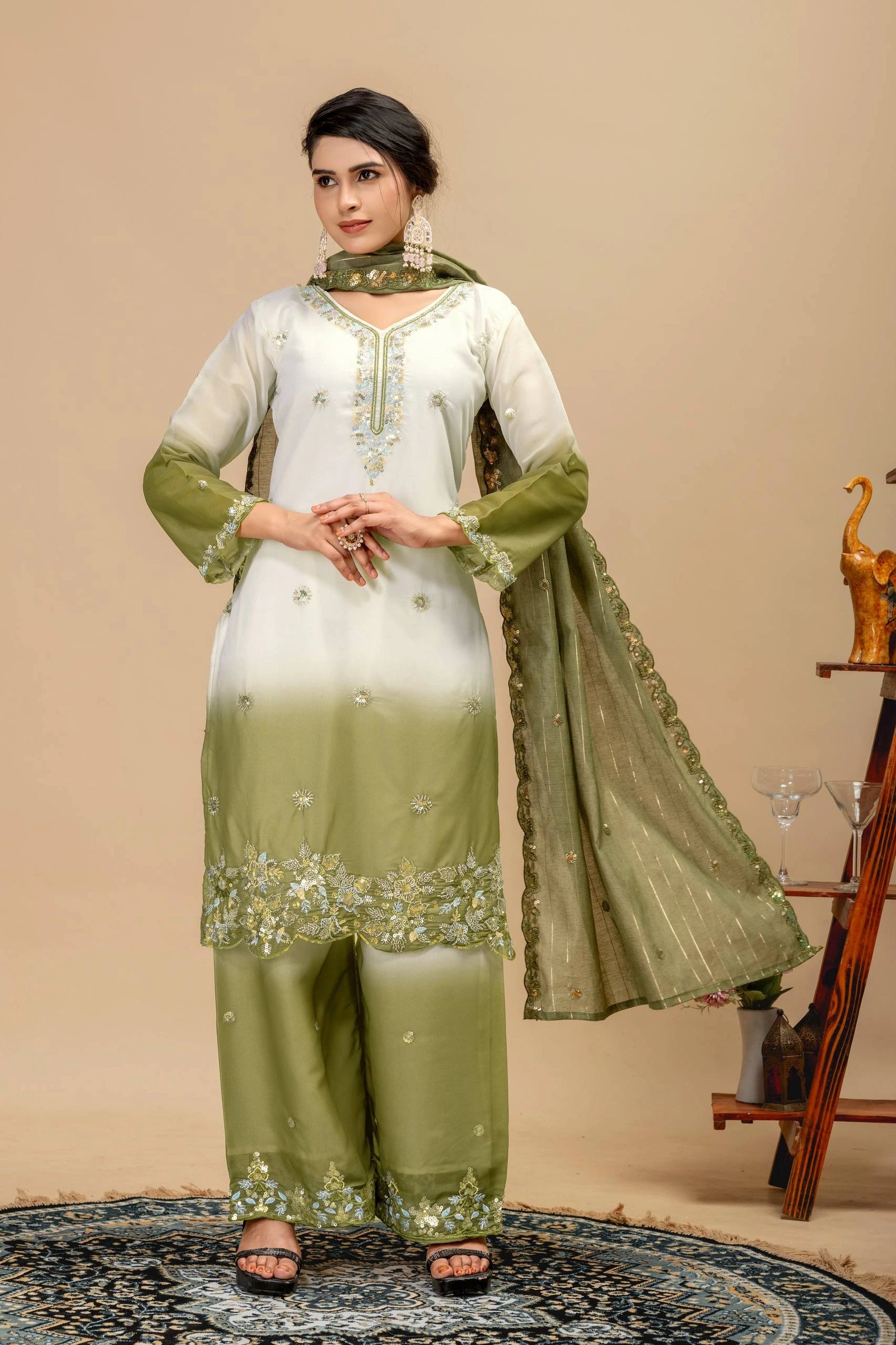 Woman wearing a green and white traditional outfit with a beige background