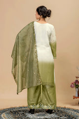Woman wearing a green and white traditional outfit with a beige background