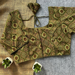 Dual-tone olive and mustard blouse featuring traditional handwork detailing
