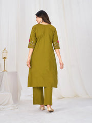 Elegant traditional outfit in refreshing green tones, highlighted by floral embroidery, pleated design, and coordinated bottoms.