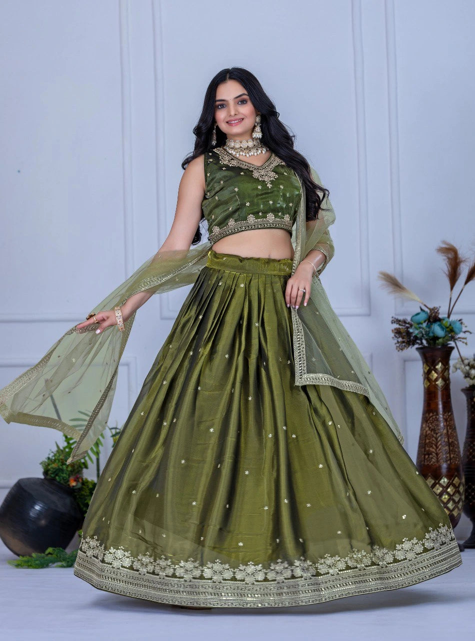 Woman wearing a green traditional outfit with a white background