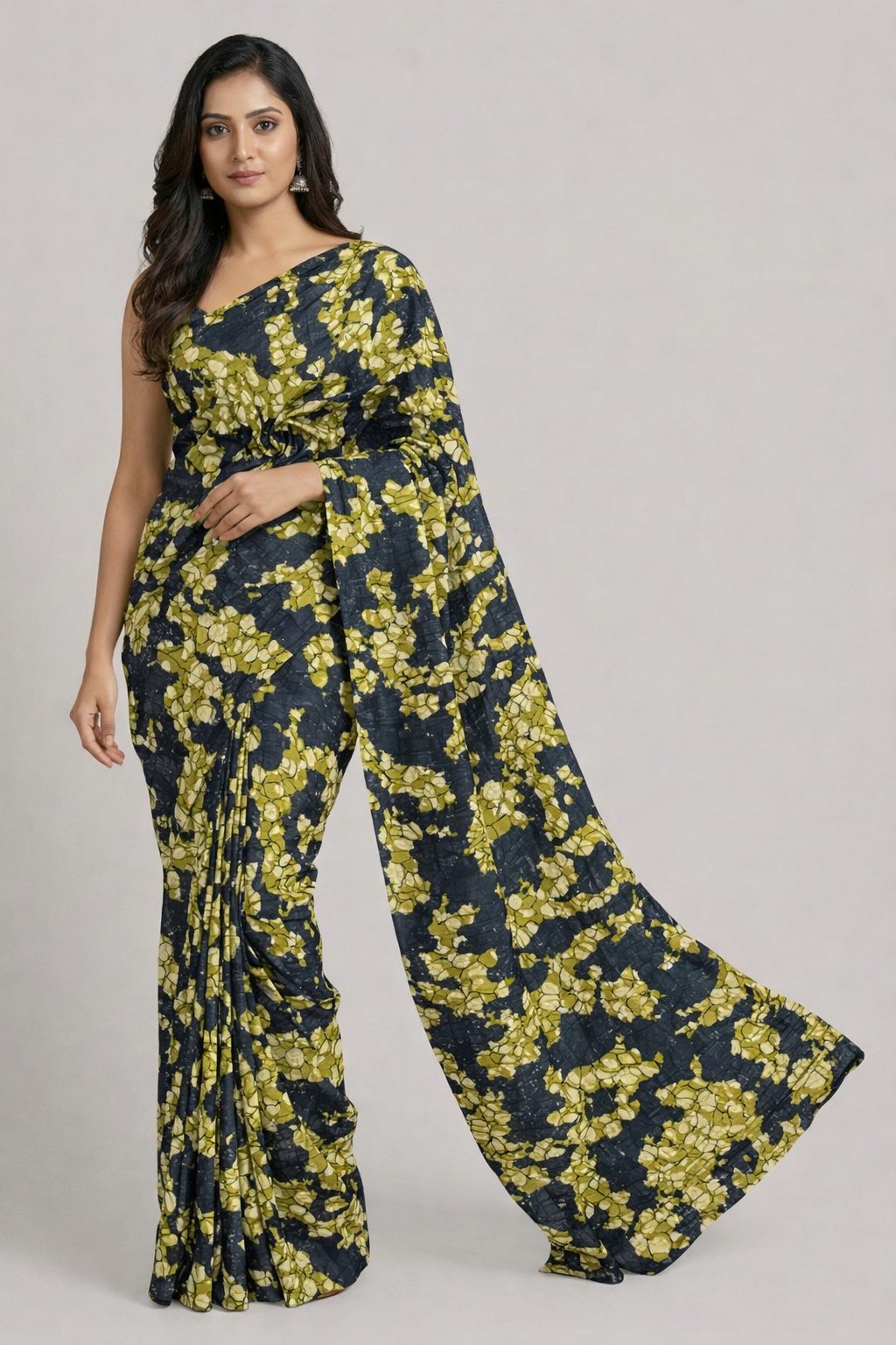 Woman wearing a floral jumpsuit on a plain background