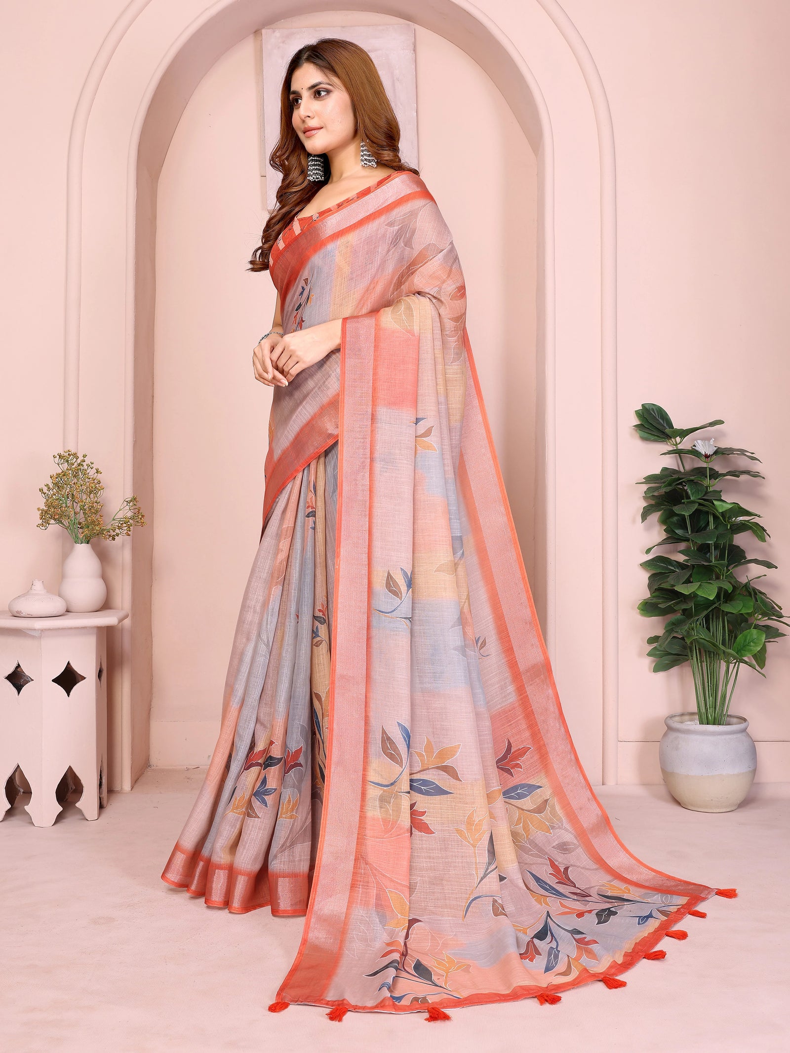 Orange Digital Floral Print Saree side drape – printed pallu with coral border and tassel detail