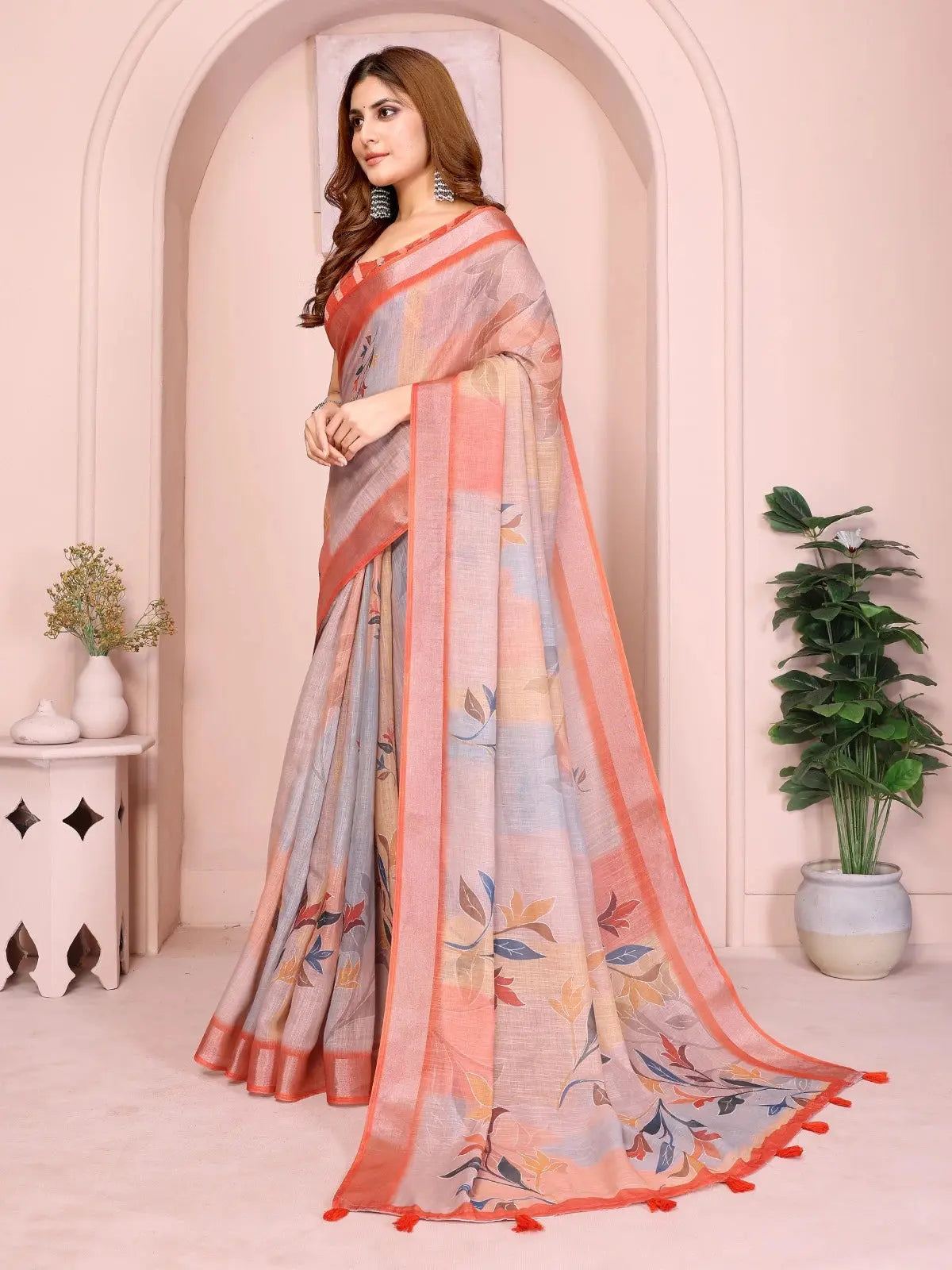 Orange Linen Cotton Saree – side drape view showing contrast border and tassels