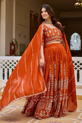 Orange sequins embroidered lehenga with dupatta draped, full length front view