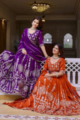 Editorial shot of orange sequins embroidered lehenga in Rajasthani palace architecture setting