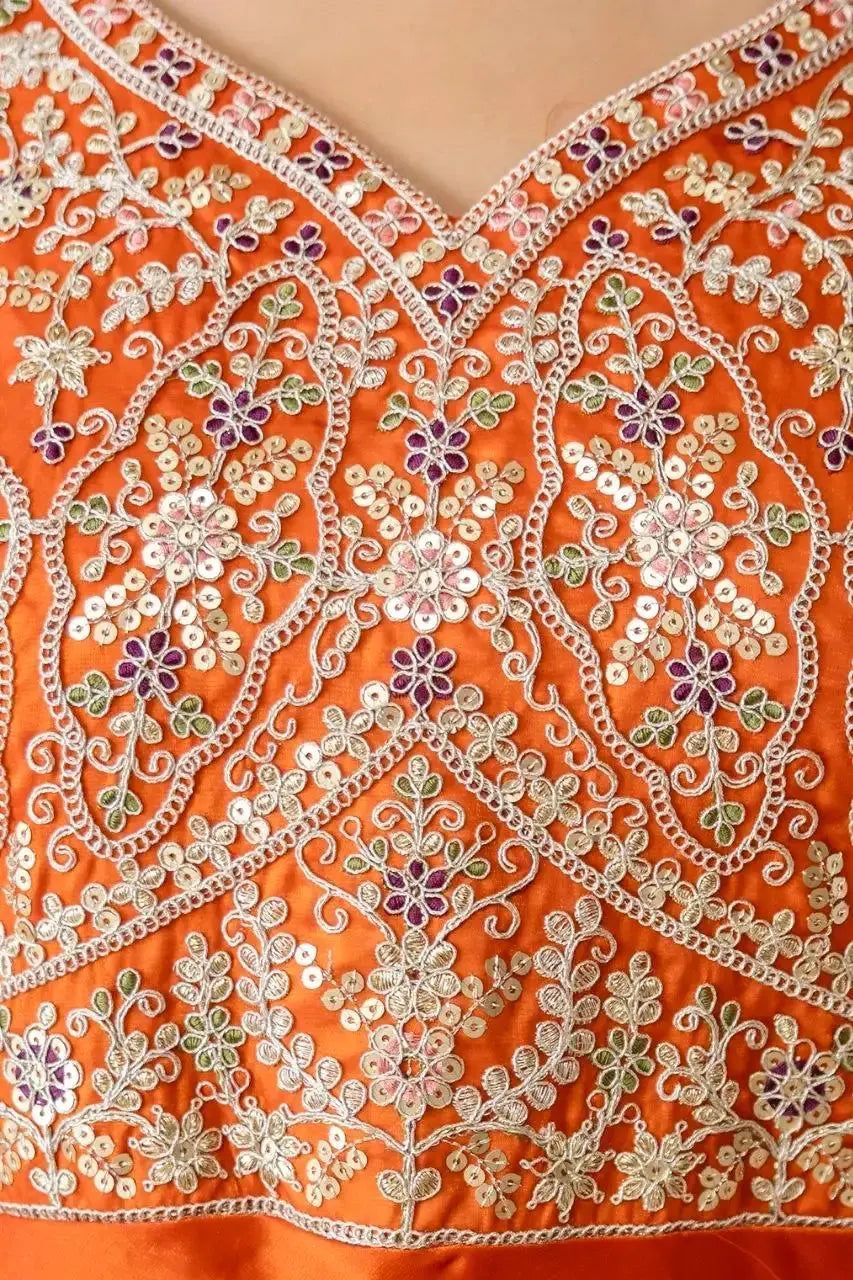 Close-Up of Sequins Embroidery on Orange Anarkali Suit – Gold Floral Motifs with Thread Work