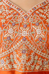 Close-Up of Sequins Embroidery on Orange Anarkali Suit – Gold Floral Motifs with Thread Work