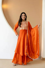 Orange Anarkali Suit with Sequins Embroidery – Model Holding Floral Booti Dupatta