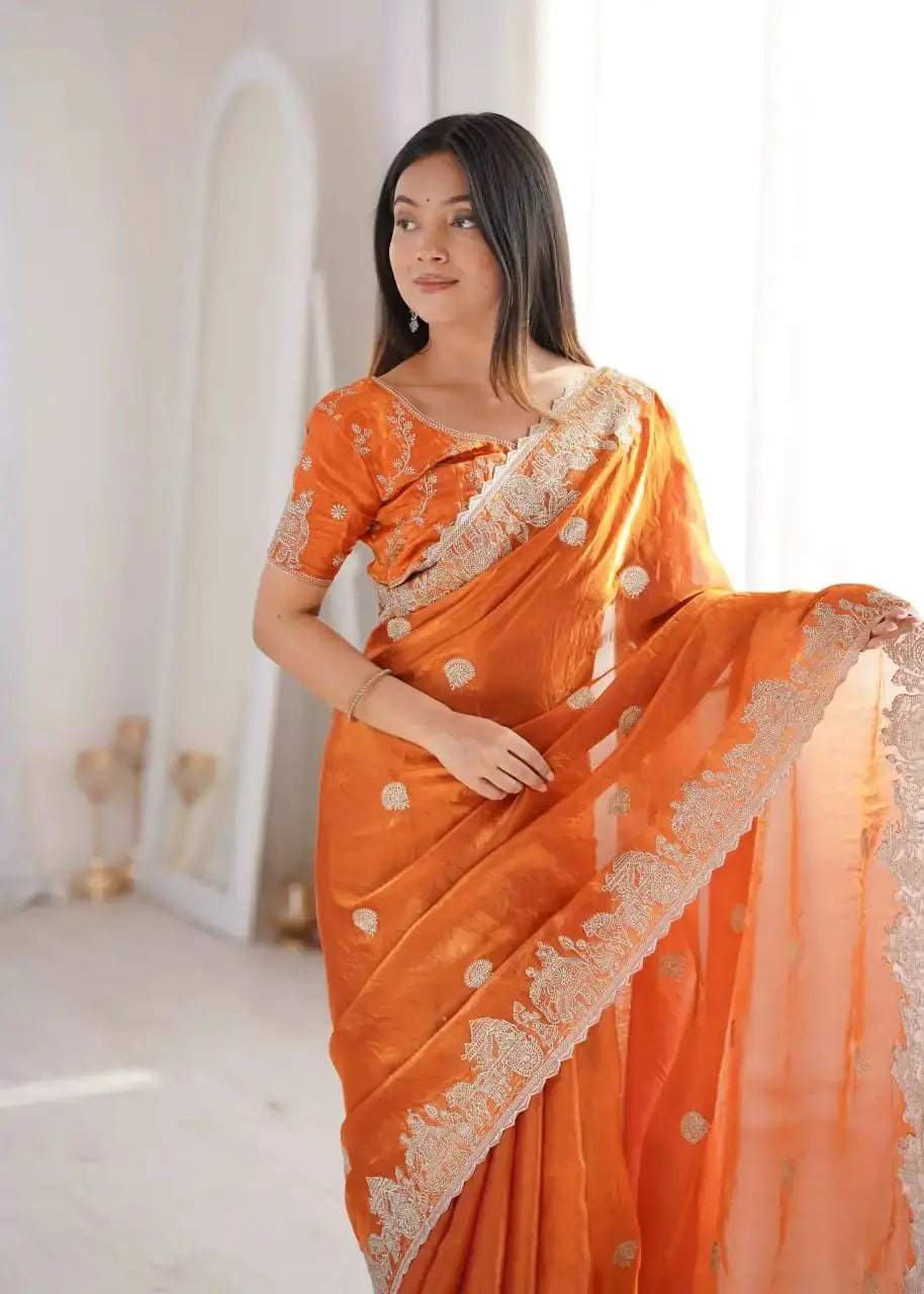 Orange Zari Embroidered Saree portrait view looking away