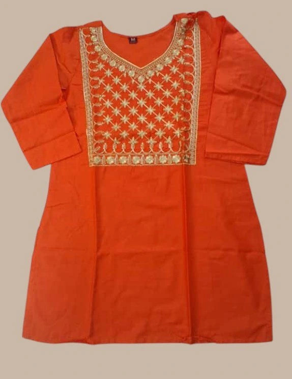 Orange kurta with gold embroidery on a beige background