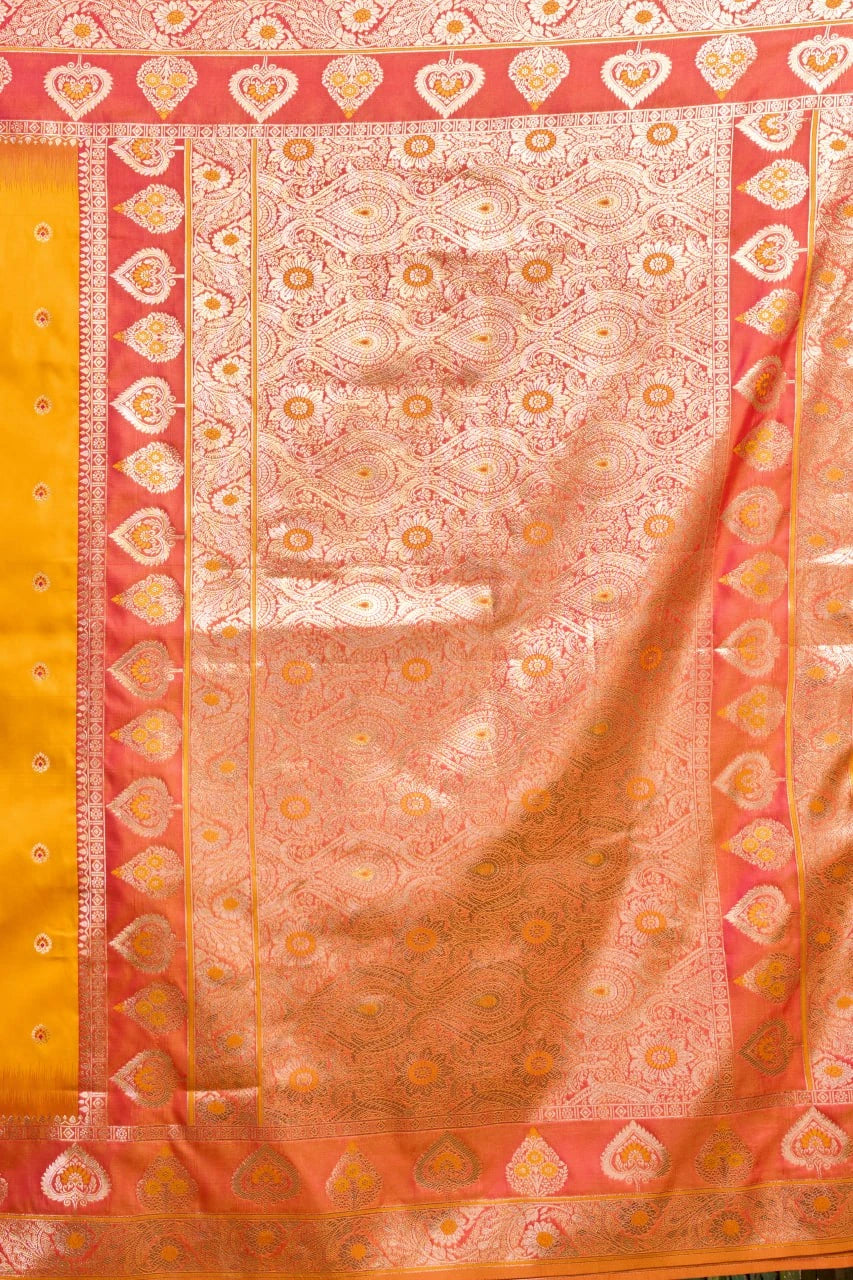 Traditional saree with a pink and yellow border and central pattern
