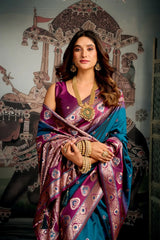 Woman in a traditional saree with jewelry against an ornate wall.