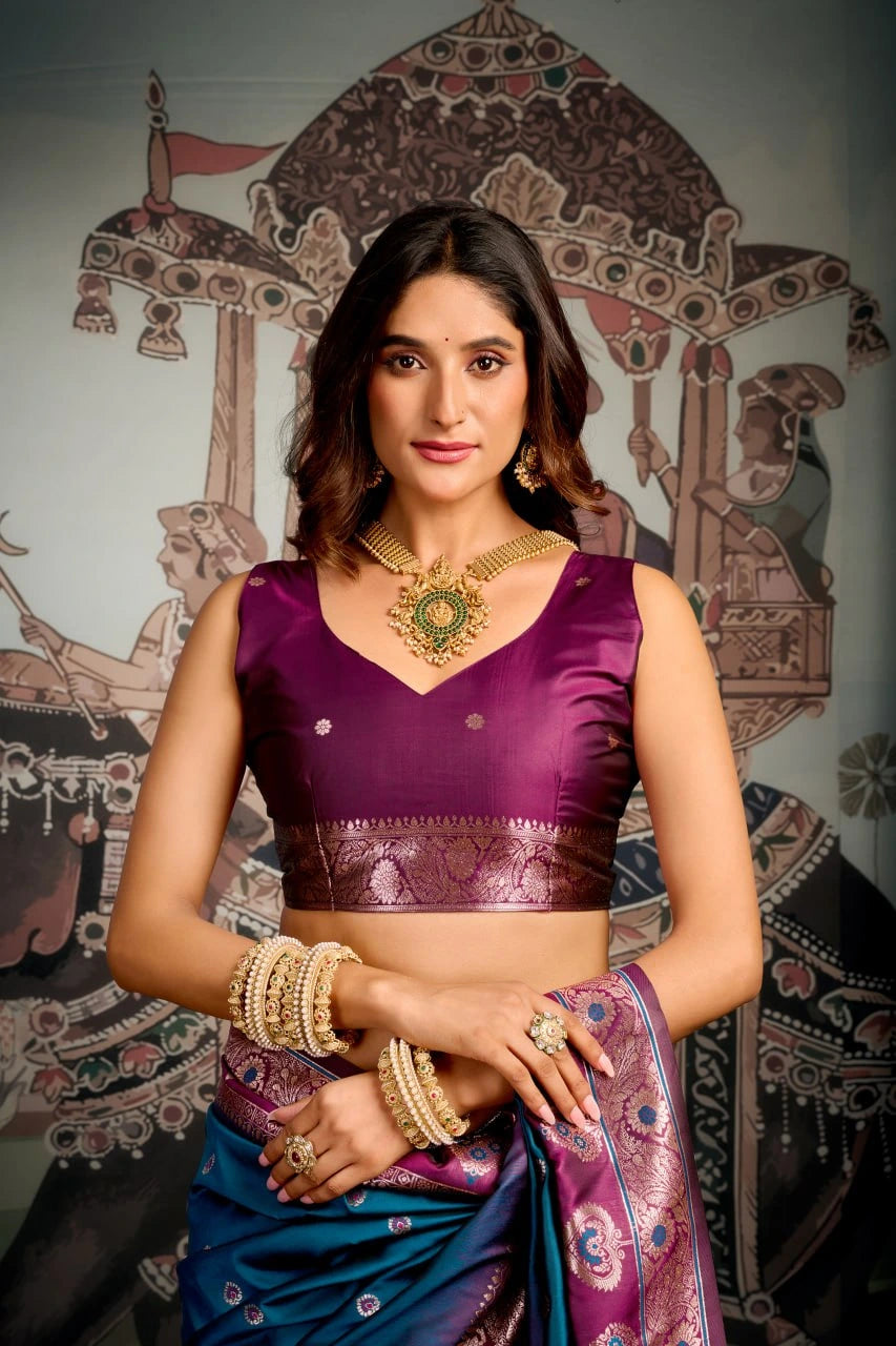 Woman in traditional attire with jewelry against a decorative background