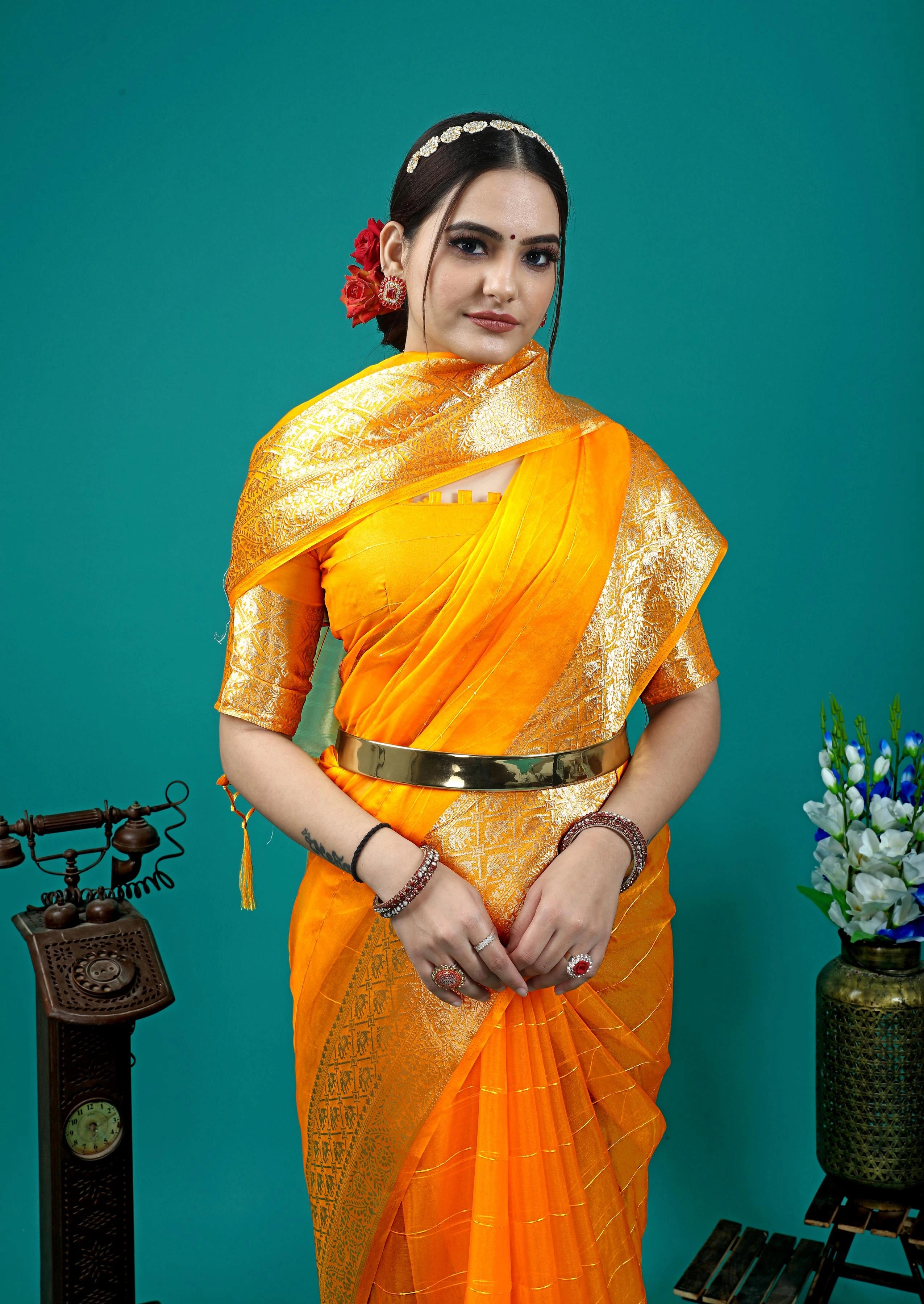 Festive ethnic saree with luxurious sheen and classic woven patterns.
