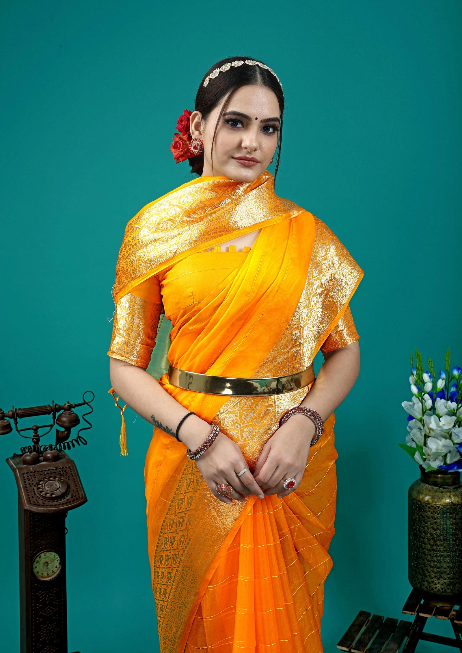 Festive ethnic saree with luxurious sheen and classic woven patterns.