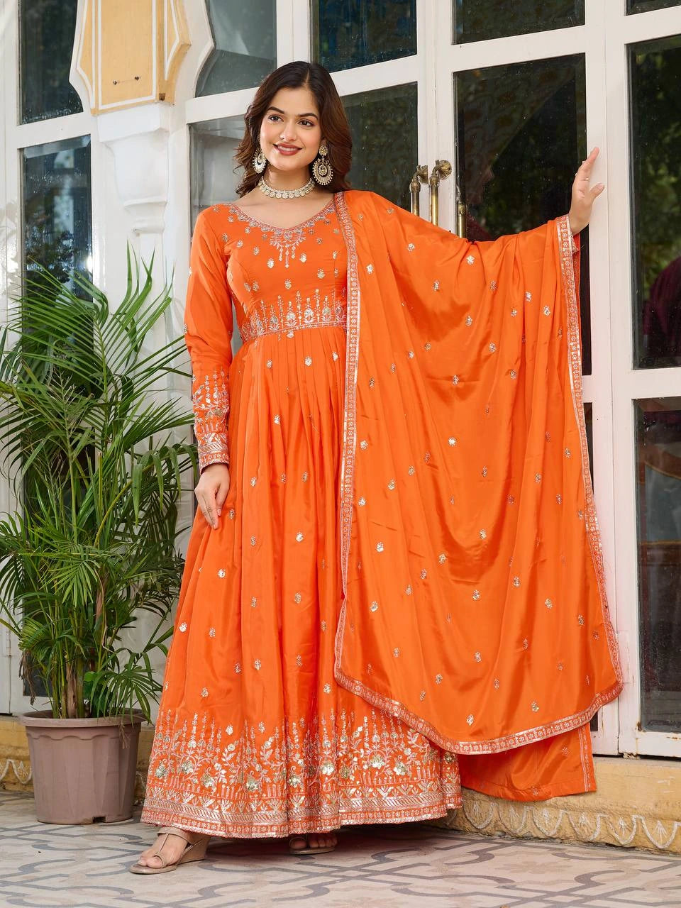 Elegant orange American silk suit with sequins and thread embroidery displayed on product page.