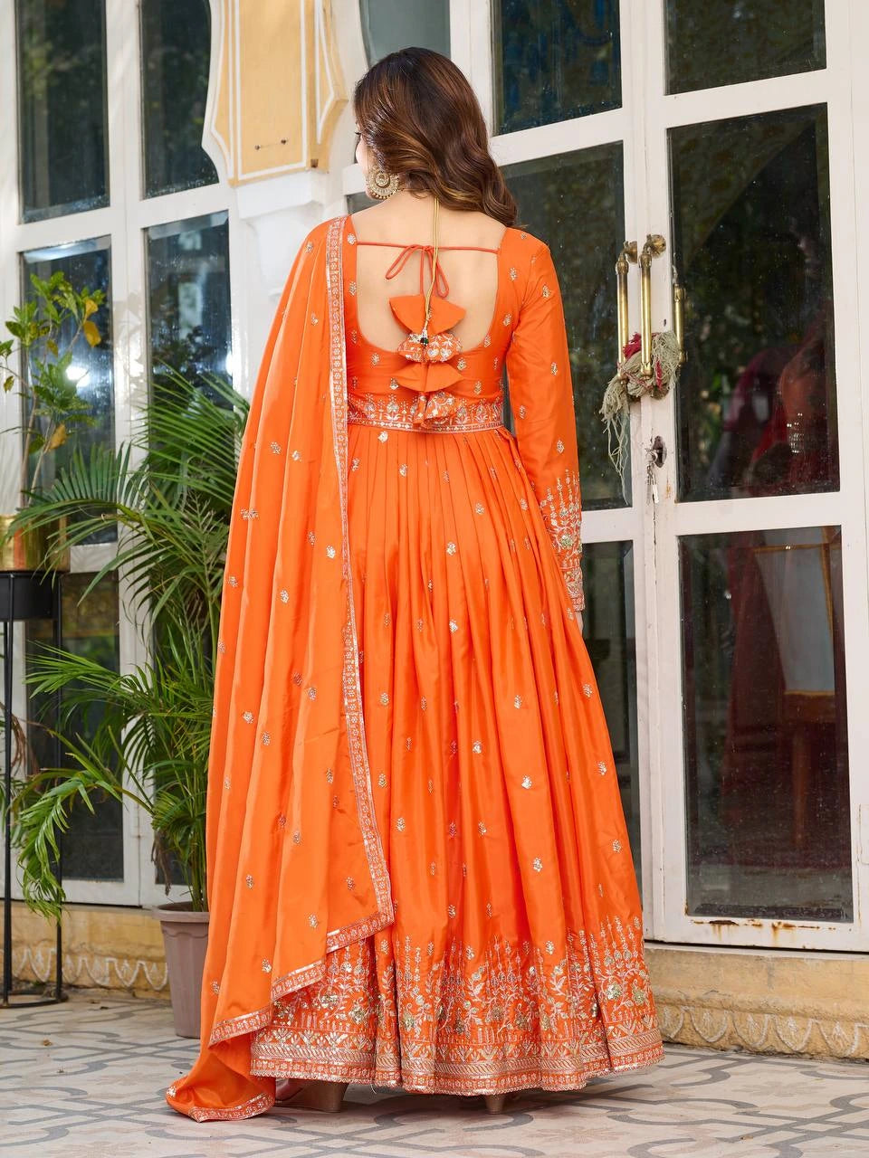 Shopify product listing showcasing orange silk suit with ornate sequins and thread embellishments.